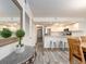 Bright and open kitchen with white cabinets, stainless steel appliances, and barstool seating at 20002 Gulf Blvd # 2803, Indian Shores, FL 33785