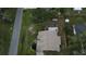 Aerial shot of a charming house featuring a fenced-in yard and an expansive rooftop at 23220 Shining Star Dr, Land O Lakes, FL 34639