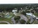 An aerial shot of the community with a basketball court, pool, and pond at 23220 Shining Star Dr, Land O Lakes, FL 34639