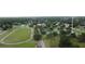 An aerial photograph features a community park with tennis courts and a track at 23220 Shining Star Dr, Land O Lakes, FL 34639
