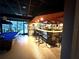 A well-stocked bar with ample seating, perfect for entertaining guests at 23220 Shining Star Dr, Land O Lakes, FL 34639