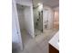 Bathroom with a glass-enclosed shower and access to walk in closet and commode room at 23220 Shining Star Dr, Land O Lakes, FL 34639