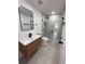 Contemporary bathroom boasts a modern vanity, sleek fixtures, and a glass-enclosed shower at 23220 Shining Star Dr, Land O Lakes, FL 34639
