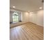 Inviting bedroom features natural light, wood-look flooring, and ample closet space at 23220 Shining Star Dr, Land O Lakes, FL 34639