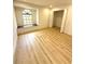 Bright bedroom boasts a cozy window seat, wood-look flooring, and an open closet at 23220 Shining Star Dr, Land O Lakes, FL 34639