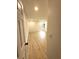 Large bedroom featuring wood-look flooring, a window view, and neutral paint at 23220 Shining Star Dr, Land O Lakes, FL 34639