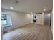 Bedroom with wood-look flooring and a barn door leading to the bathroom at 23220 Shining Star Dr, Land O Lakes, FL 34639