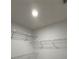 Walk-in closet with shelving and recessed lighting for optimal storage at 23220 Shining Star Dr, Land O Lakes, FL 34639