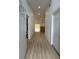 Inviting foyer showcasing modern hardwood flooring and an open layout, perfect for welcoming guests at 23220 Shining Star Dr, Land O Lakes, FL 34639