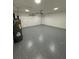 Spacious garage with epoxy floor and updated door at 23220 Shining Star Dr, Land O Lakes, FL 34639