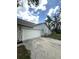 Attached two-car garage with stone accents and functional design, plus plenty of room for vehicles at 23220 Shining Star Dr, Land O Lakes, FL 34639