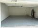 Well-lit garage with finished floor offers ample space for parking and storage at 23220 Shining Star Dr, Land O Lakes, FL 34639