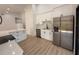 Modern kitchen with stainless steel appliances, white cabinets, and quartz countertops at 23220 Shining Star Dr, Land O Lakes, FL 34639