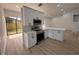 Modern kitchen features white cabinets, stainless steel appliances, and a spacious island at 23220 Shining Star Dr, Land O Lakes, FL 34639