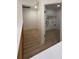 Upstairs hallway showcases an open laundry room, with white wire shelving and hookups at 23220 Shining Star Dr, Land O Lakes, FL 34639