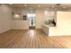 Open-concept living room with wood floors and lots of natural light from front entry at 23220 Shining Star Dr, Land O Lakes, FL 34639