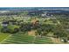 Aerial view of property featuring a large yard with trees, farmland, and residential areas nearby at 3102 E Trapnell Rd, Plant City, FL 33566