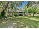 Well maintained backyard with lush lawn and a screened pool enclosure at 3102 E Trapnell Rd, Plant City, FL 33566