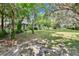 Backyard with shady areas and lots of green space at 3102 E Trapnell Rd, Plant City, FL 33566