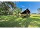 Barn with adjacent fenced pasture perfect for equestrian or agricultural use at 3102 E Trapnell Rd, Plant City, FL 33566