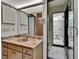 Bathroom boasts marble countertop, vanity, and step-in shower at 3102 E Trapnell Rd, Plant City, FL 33566