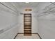A walk-in closet with built-in shelving and wire racks for organized storage at 3102 E Trapnell Rd, Plant City, FL 33566