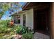 Inviting front entry with mature landscaping and textured exterior at 3102 E Trapnell Rd, Plant City, FL 33566
