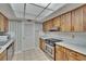Traditional kitchen featuring wood cabinets and white marble countertops at 3102 E Trapnell Rd, Plant City, FL 33566
