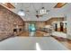 Open living space showcasing the fireplace, bar area, and view of the pool at 3102 E Trapnell Rd, Plant City, FL 33566