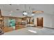 Inviting living area with unique lighting fixtures, hardwood floors, and brick accents at 3102 E Trapnell Rd, Plant City, FL 33566