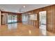 Spacious living room with wood floors, sliding glass doors, and a view of the pool at 3102 E Trapnell Rd, Plant City, FL 33566
