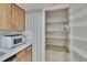 A pantry featuring shelving and storage space with a floral design at 3102 E Trapnell Rd, Plant City, FL 33566