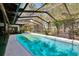 Beautiful in-ground screened pool in outdoor living space at 3102 E Trapnell Rd, Plant City, FL 33566