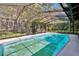 Large in-ground pool in screened enclosure with views of the backyard at 3102 E Trapnell Rd, Plant City, FL 33566