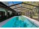 Large screened pool with attached outdoor space, ideal for relaxing and entertaining at 3102 E Trapnell Rd, Plant City, FL 33566