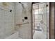 Accessible shower with bench, grab bars, and tiled walls at 3102 E Trapnell Rd, Plant City, FL 33566