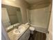 Bathroom featuring vanity with light countertop, a large mirror, and a shower-tub combo at 35233 White Water Lily Way, Zephyrhills, FL 33541
