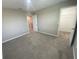 Bedroom featuring carpet flooring, a neutral wall color, and a walk-in closet at 35233 White Water Lily Way, Zephyrhills, FL 33541