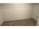 This closet features a wire shelf for organization and a carpeted floor at 35233 White Water Lily Way, Zephyrhills, FL 33541