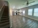 Spacious living room features hard surface floors and plenty of natural light from the many windows at 35233 White Water Lily Way, Zephyrhills, FL 33541