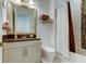 Bathroom showcasing a granite countertop vanity, contemporary toilet and a shower-tub combo at 4372 Night Star Trl, Odessa, FL 33556