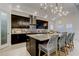 Well-appointed kitchen features a large center island with bar seating, and pendant lighting at 4372 Night Star Trl, Odessa, FL 33556