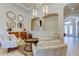 Comfortable living room with elegant furnishings, arched doorways, and a view of the bright foyer at 4372 Night Star Trl, Odessa, FL 33556
