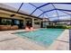 Inviting pool area with lounge chairs, an outdoor dining space, and a spacious patio at 4372 Night Star Trl, Odessa, FL 33556