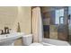Bathroom featuring a shower-tub with tiled walls, sink with fixtures, and a vanity mirror at 500 62Nd S St, St Petersburg, FL 33707