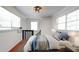 Comfortable bedroom featuring a cozy bed, bright windows, and stylish lighting at 500 62Nd S St, St Petersburg, FL 33707