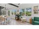 Cozy dining room with modern furnishings, natural lighting, and views of the front yard at 500 62Nd S St, St Petersburg, FL 33707