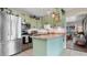 Well-lit kitchen featuring stainless steel appliances, butcher block countertops, and charming decor at 500 62Nd S St, St Petersburg, FL 33707