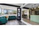 Open floor plan featuring a living room, dining area, and modern kitchen with a breakfast bar at 500 62Nd S St, St Petersburg, FL 33707