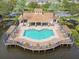 Aerial view of the large community pool and pavilion area showing lots of lounging and seating with well kept grounds at 7903 Seminole Blvd # 2203, Seminole, FL 33772